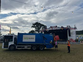 Bin Truck With Stage In Background