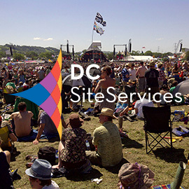 DC Site Services logo over Glastonbury Festival Pyramid Stage photo