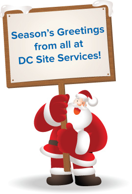 DC Site Services Christmas Santa holding sign