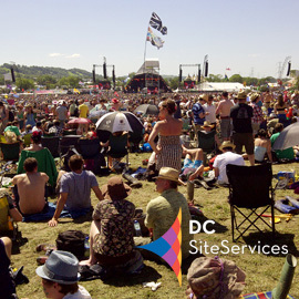 DC Site Services logo over Glastonbury Festival Pyramid Stage photo