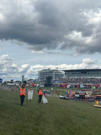 Niko & Someone Litter Picking With Rowd In The Background
