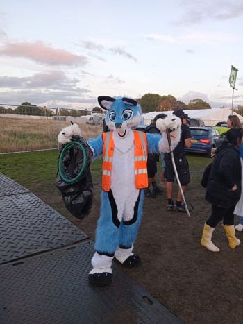 Mascot In Our Uniform With Litter Pick And Bag