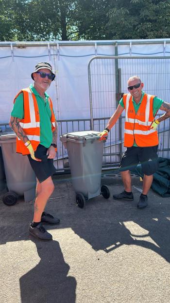 John And Steve Smiling By Bin