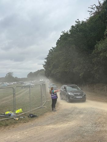 Sammi Directing Traffic Dusty Carpark