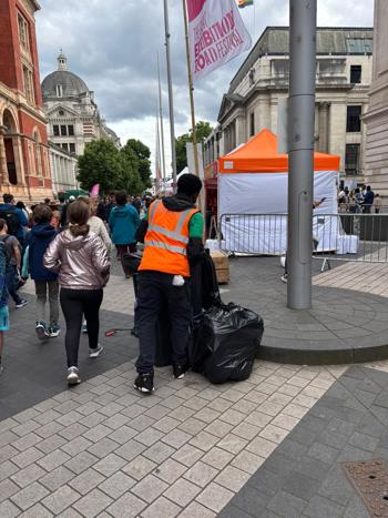 Crew Member With Rubbish Bag