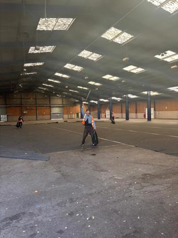 Ian Wearing Short Denim Jacket Holding Litter Pick & Bag