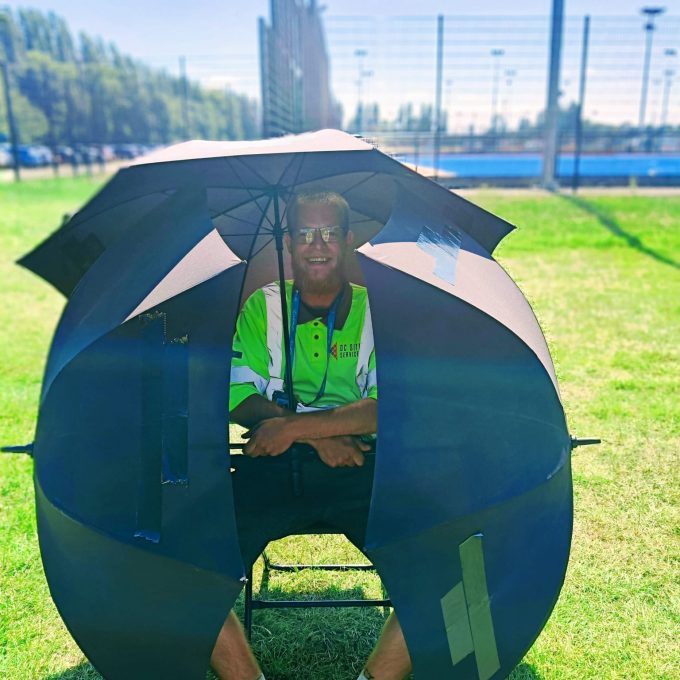 Byron Surrounded By Umbrellas