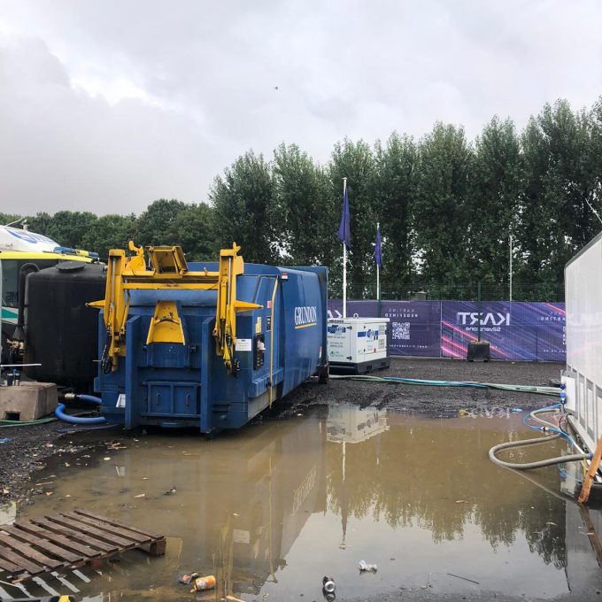 Compactor Next To Massive Puddle