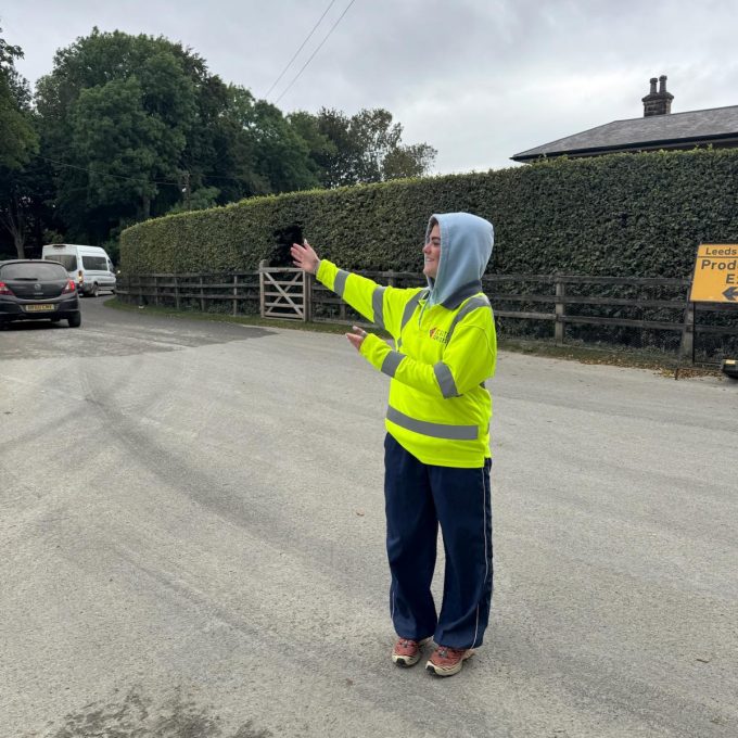 Crew Member Directing Traffic Hood Up