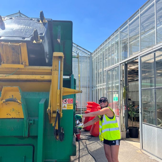 Crew Member Using Compactor