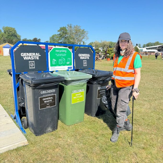 Crew Member With Litter Pick By The Bins