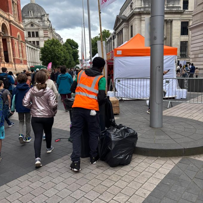 Crew Member With Rubbish Bag