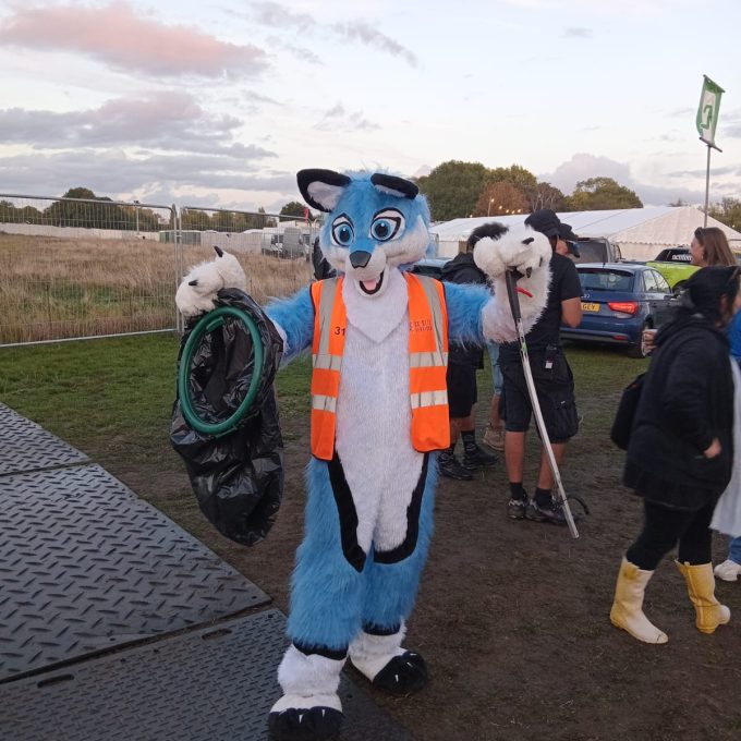 Mascot In Our Uniform With Litter Pick And Bag