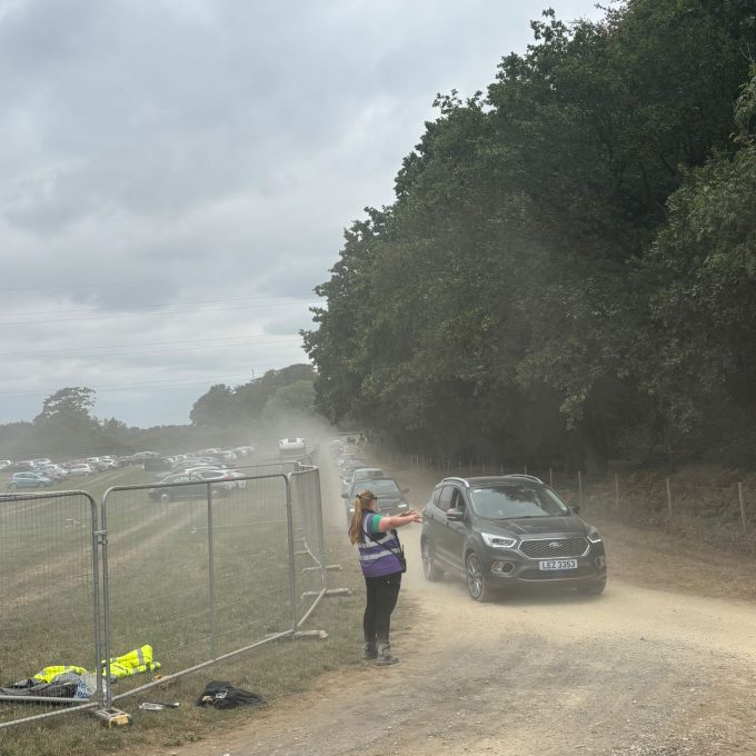 Sammi Directing Traffic Dusty Carpark