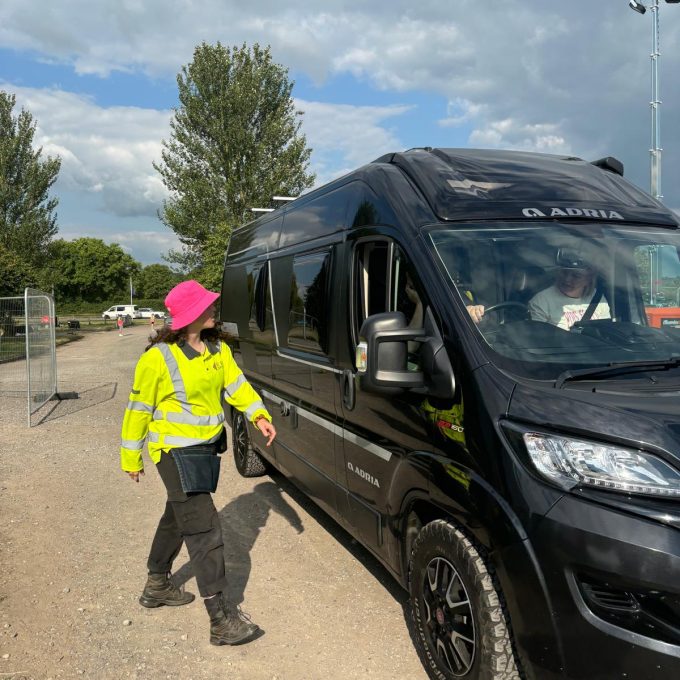 Staff Guiding Traffic Pink Hat Face On