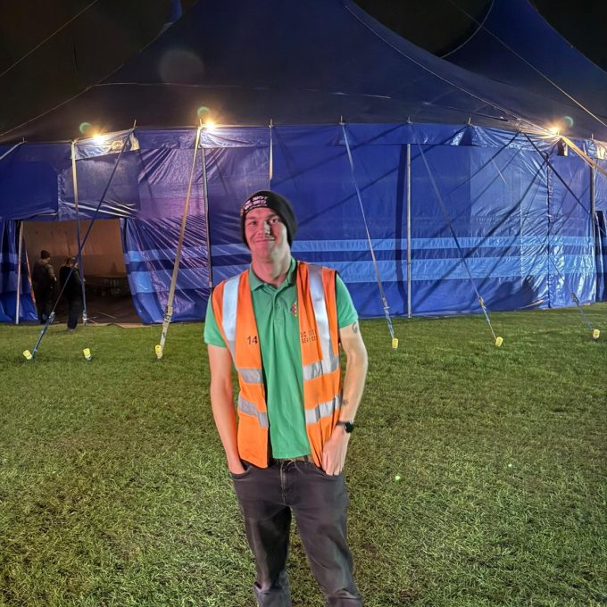 Zak Read Infront Of Tent
